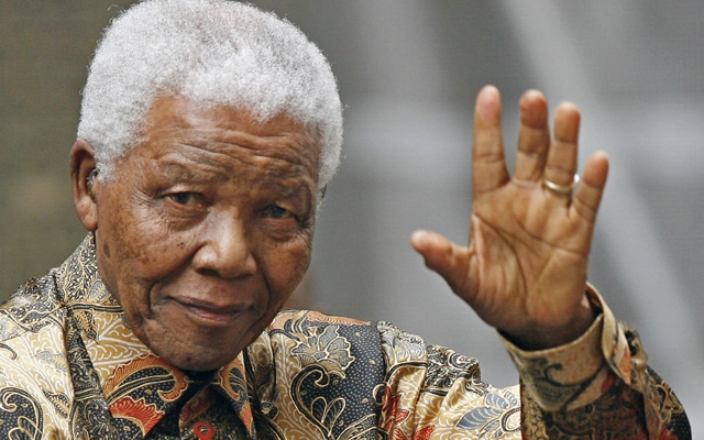 Above: Former South African President Nelson Mandela waves as he arrives in central London, England. August 28, 2007