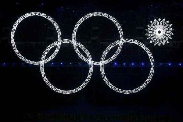 Above: One of the Olympic rings malfunctions during Sochi's Opening Ceremony