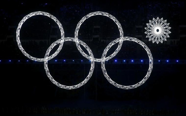 Above: One of the Olympic rings malfunctions during Sochi's Opening Ceremony