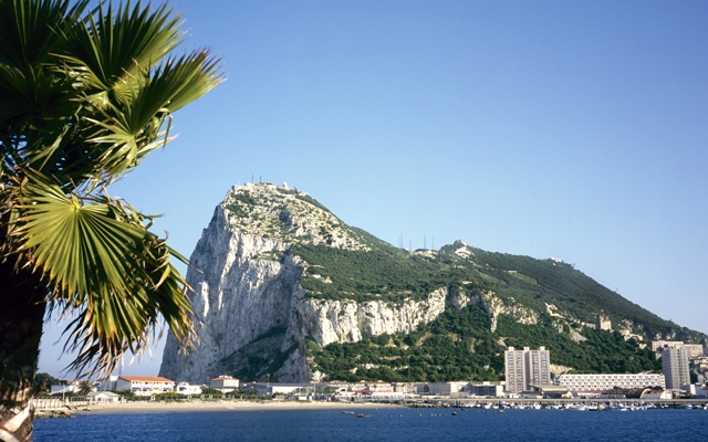 Gibraltar on a sunny day seen from across the bay (Photo: robert paul van beets/Shutterstock)