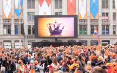 Above: Thousands gather in Dam Square after the royal inauguration and speech of King Willem-Alexander, April 30, 2013, Amsterdam, The Netherlands (Photo credit: Gertan/Shutterstock)