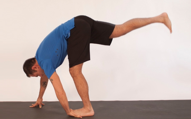 Above: Michael DeCorte demonstrates balancing with a leg and wrist stretch (Photo credits: Glenn Gebhardt)