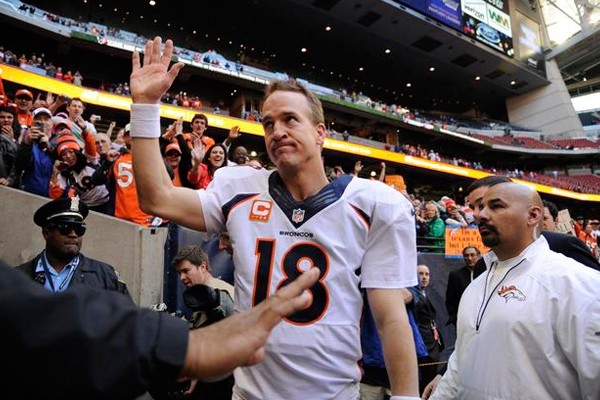 Above: The Broncos' Peyton Manning after he set an NFL record with his 51st touchdown pass