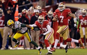 Above: Quarterback Colin Kaepernick runs for a 56-yard touchdown in the third quarter, before the 49ers victory against the Carolina Panthers in the NFC divisional round