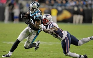 Carolina Panthers' Ted Ginn (19) runs past New England Patriots' Kyle Arrington (25) for a touchdown during the second half of an NFL football game in Charlotte, N.C., Monday, Nov. 18, 2013. The Panthers won 24-20