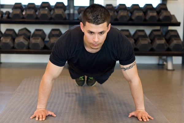 Learn how to perform a Wide Push-Up (Photos by: Timothy Flynn - Dearhunter Photography)