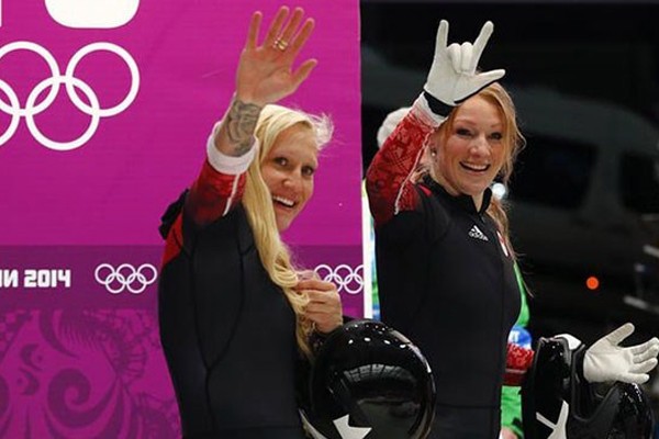 Canadians Kaillie Humphries and Heather Moyse made Olympic history by becoming the first women bobsledders to repeat as Olympic champions on Wednesday