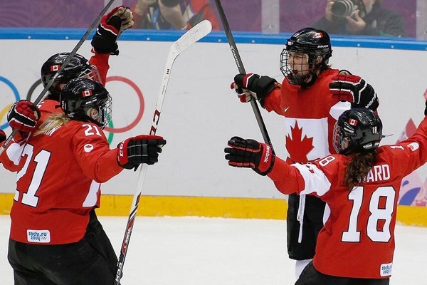 Above: Canada wins gold in women's hockey, beating USA in overtime