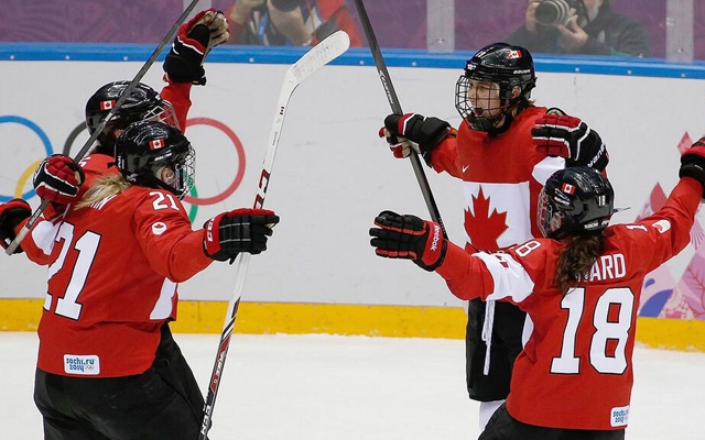 Above: Canada wins gold in women's hockey, beating USA in overtime