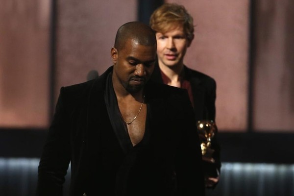 Above: Kanye West stole the spotlight at the Grammys once again by rushing to the stage when Beck won the Album of the Year award for his 'Morning Phases'