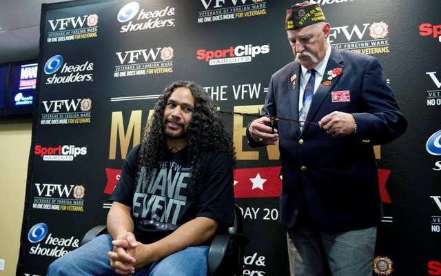 Troy Polamalu cuts one of his legendary locks to support veterans