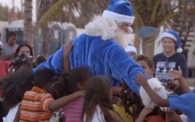 Above: WestJet's latest video takes a blue-costumed Santa to the Dominican Republic