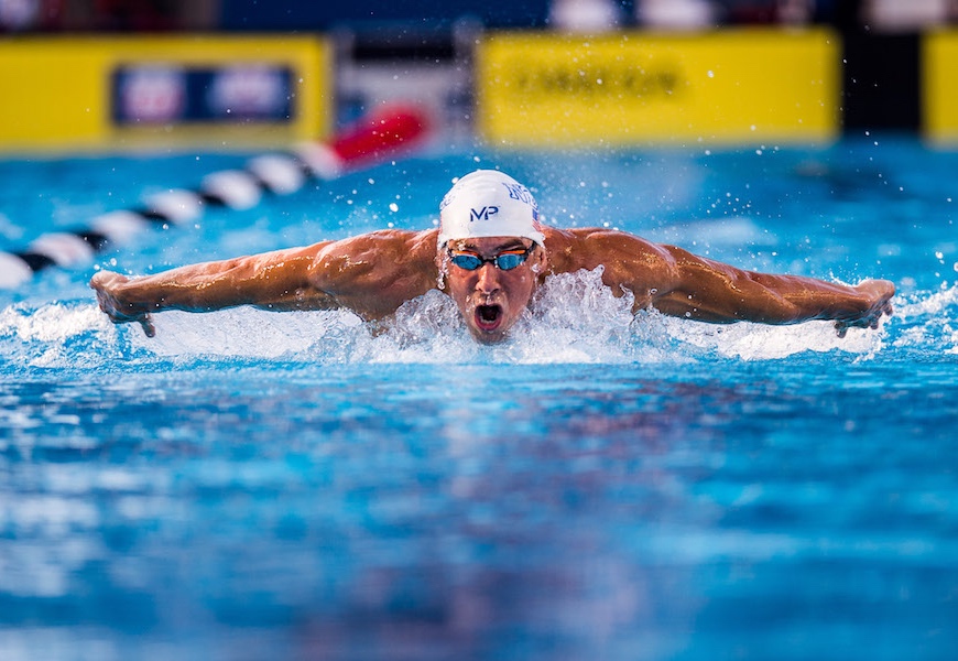 Above: Michael Phelps competes in the 200 meter butterfly
