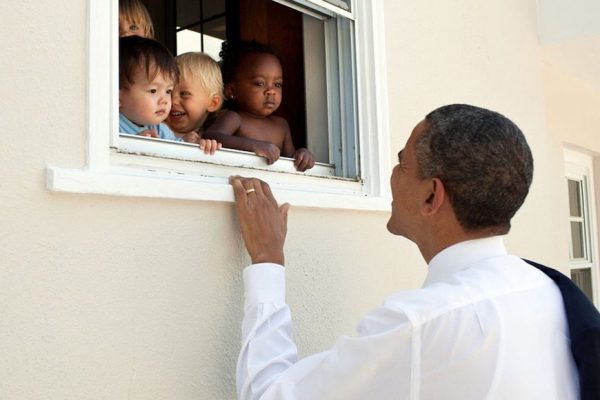 Above: Obama greets four children in Bethesda, Md (2011)
