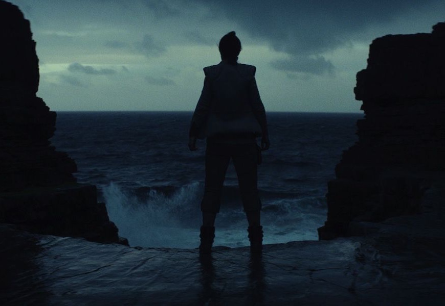Above: A shadowy Rey (Daisy Ridley) peers into rough waters