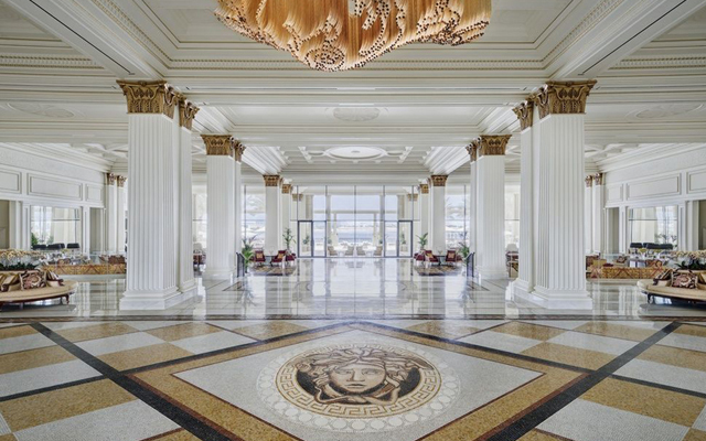 Above: The grand lobby and the extraordinary marble mosaic at the Palazzo Versace